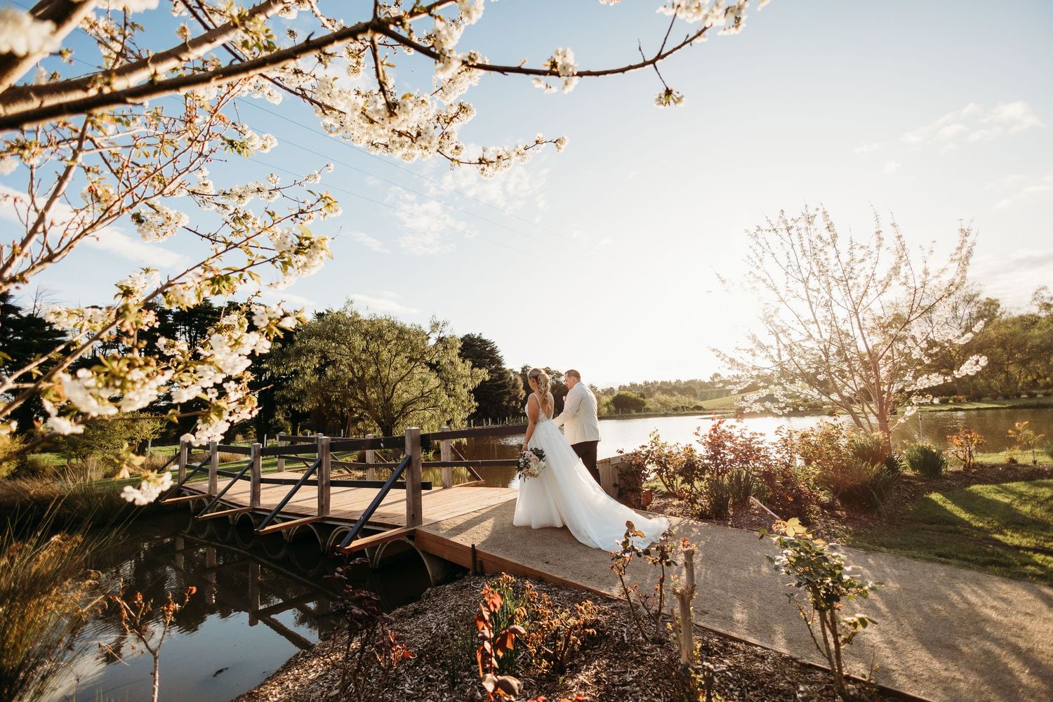 Candid shot by a Yarra Valley wedding photographer, capturing a couple's tender moment among the region's picturesque vi