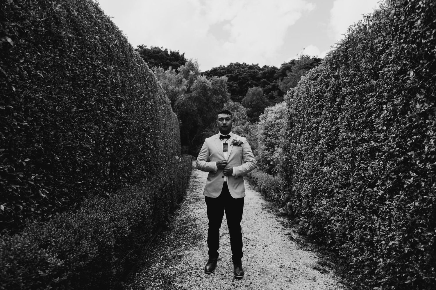 Captivating groom shot in Auckland, New Zealand, showcasing the essence of sophistication and confidence. The groom, imp