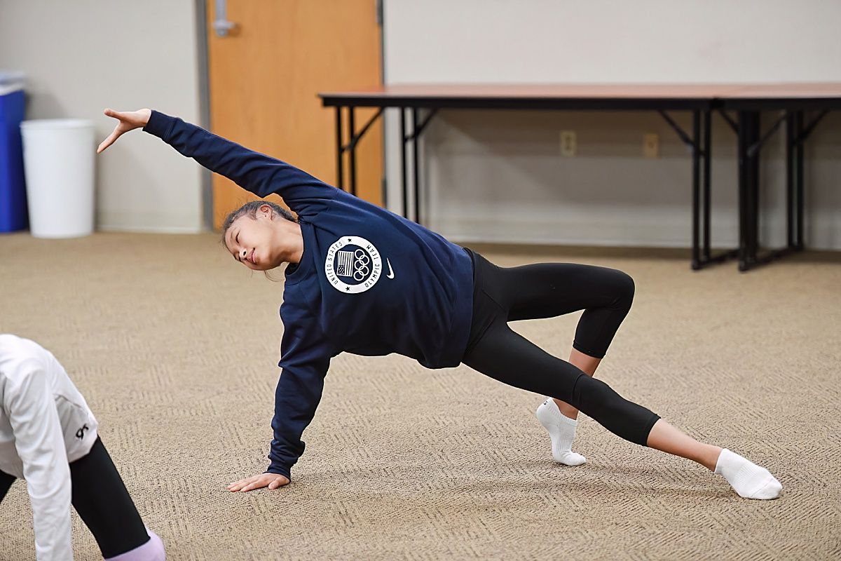 Rhythmic gymnast floor improv dance