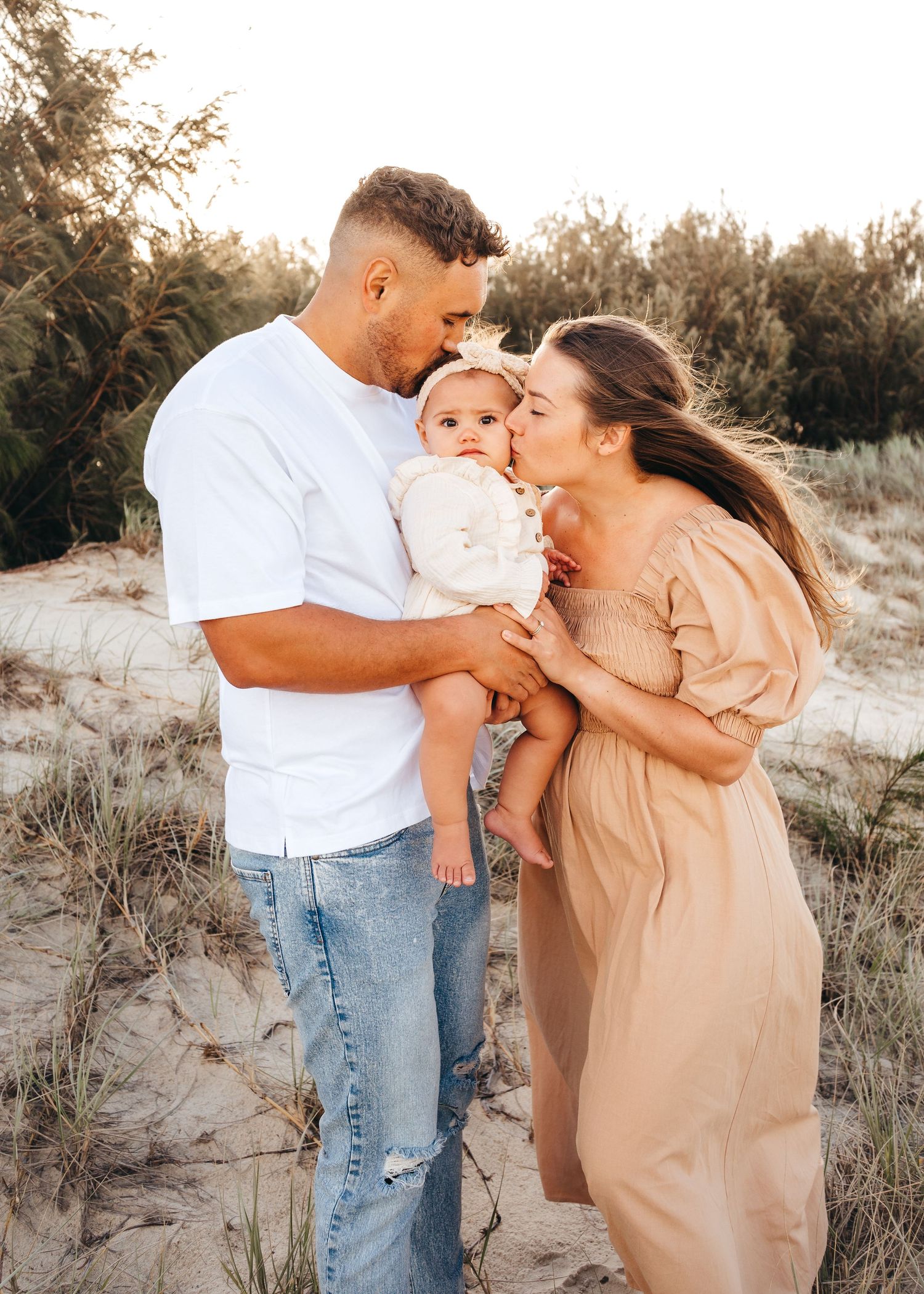 An beautiful family session moment at Rainbow Beach, Queensland with Nicole Bailey Photography