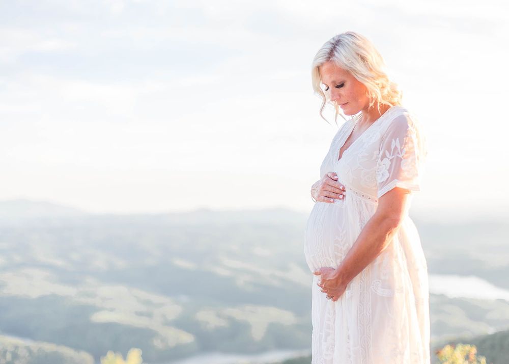 pregnant woman holding stomach, baby photography near me chattanooga, family photographers ooltewah apison, infant photo
