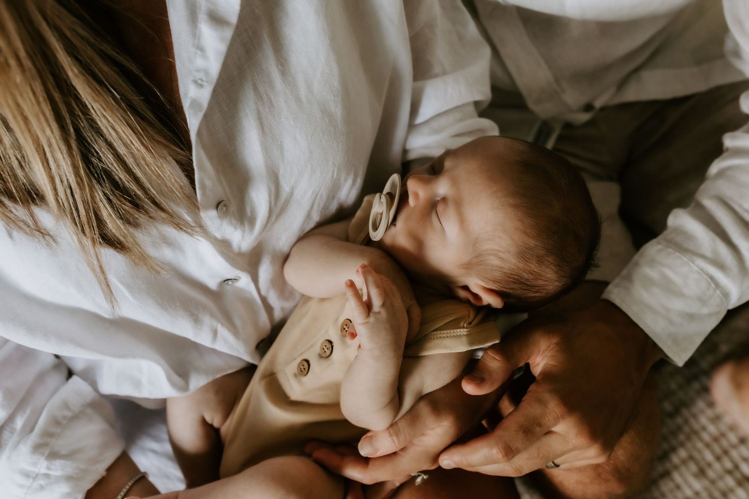Close-up view of family bonding during intimate lifestyle photography session.