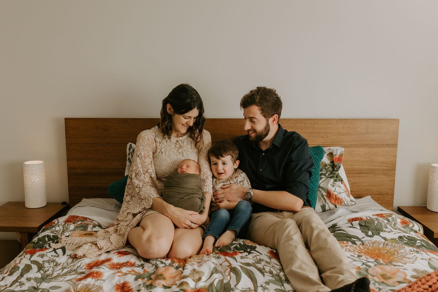 Panoramic series of intimate family moments captured on bed with natural window lighting.