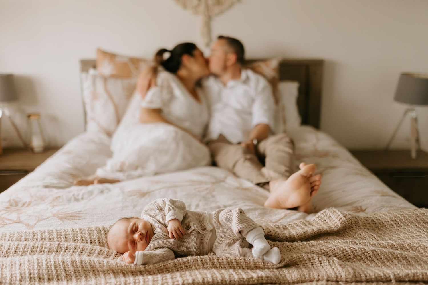 Lifestyle photo of cozy bed with white linens and soft natural lighting.