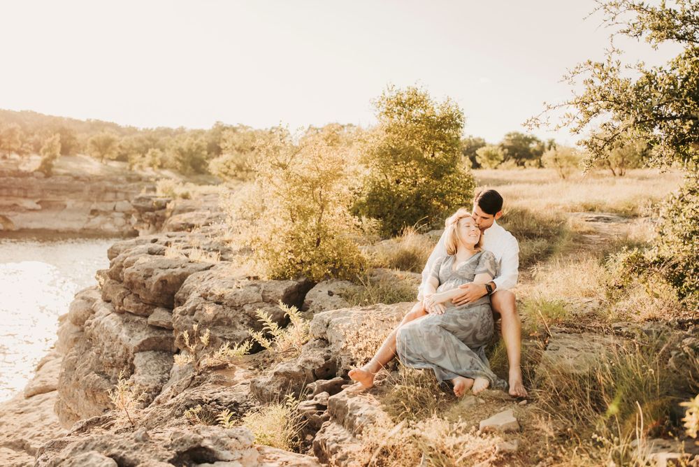 sweet couple snuggles up on a hike