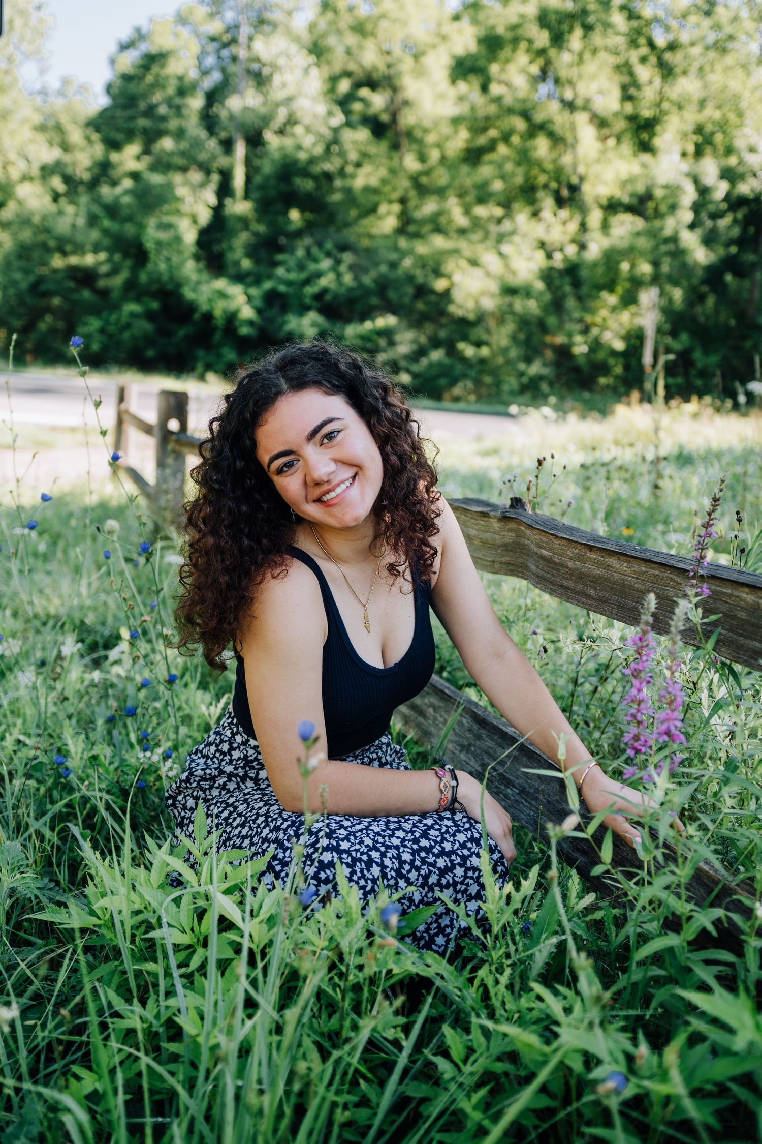 Cheerful summer portraits among purple wildflowers in a meadow.