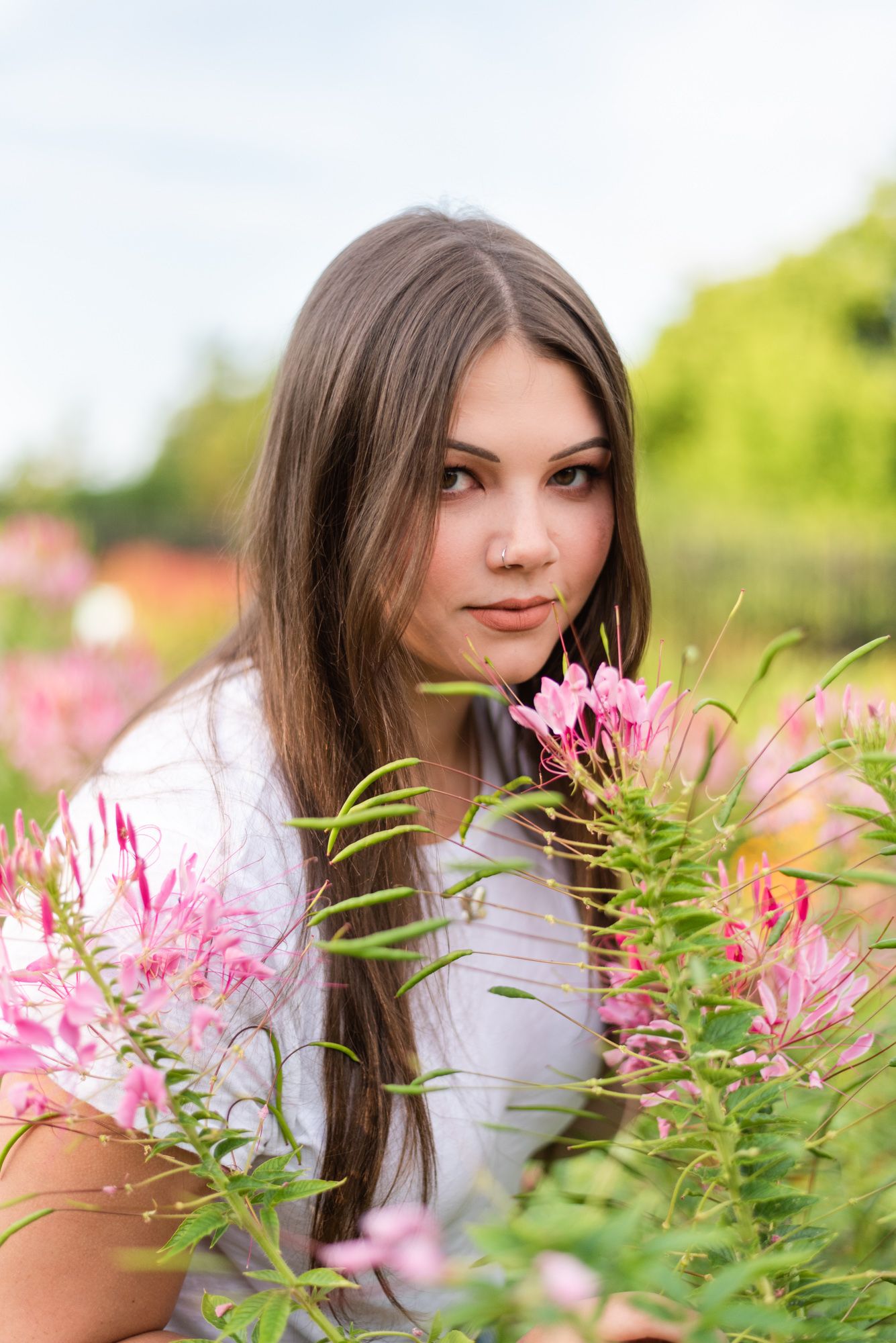 Senior smelling flowers at Hartwood Acres in Pittsburgh Pennsylvania