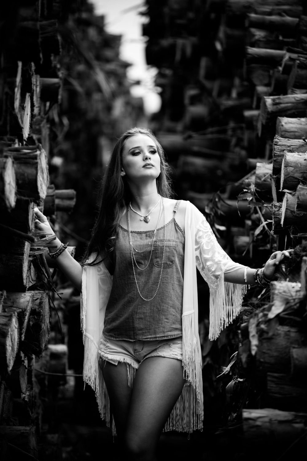 Artistic black and white portrait series with vintage fringe and dramatic poses.