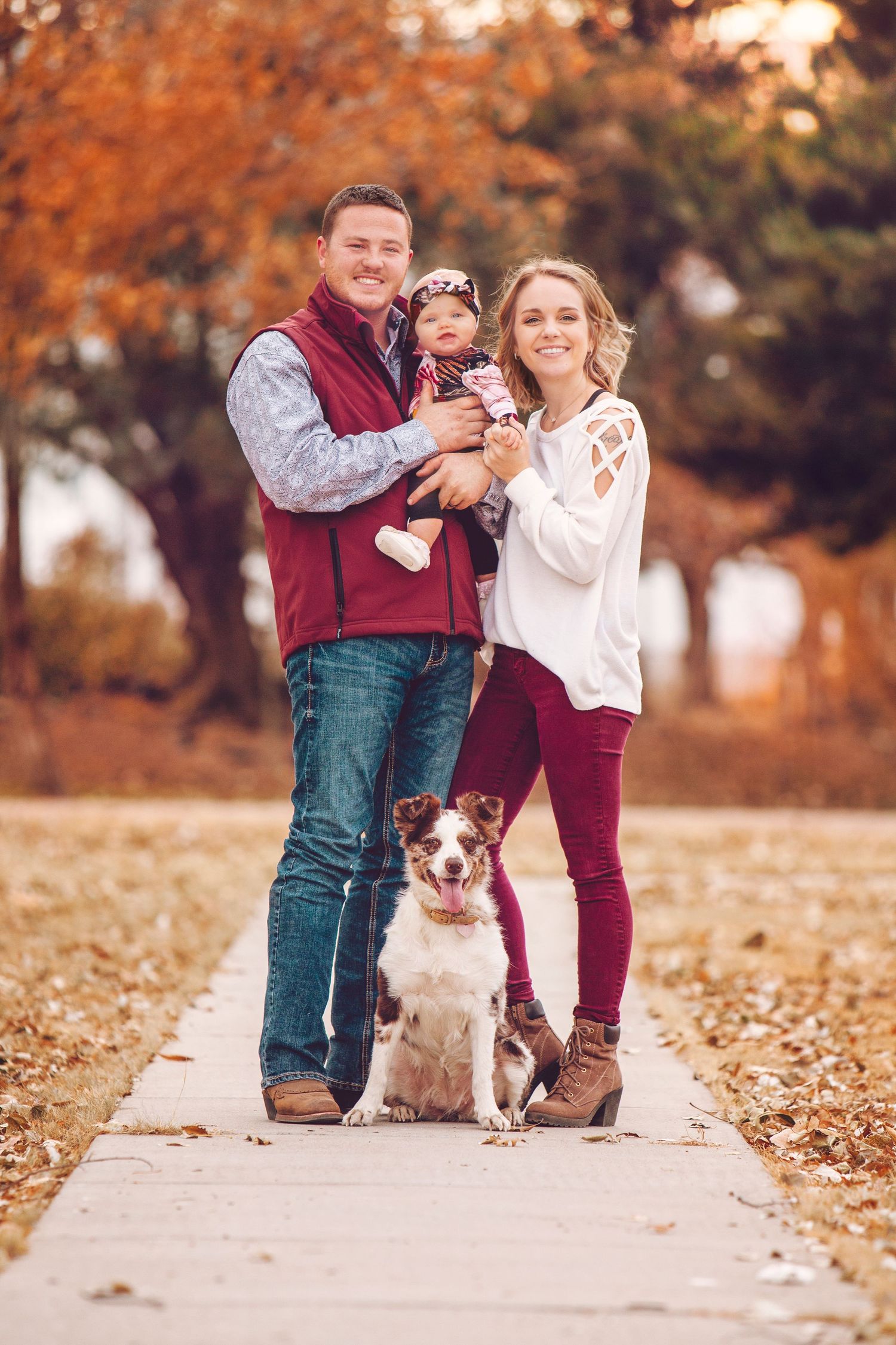 Family poses with dog in family photo