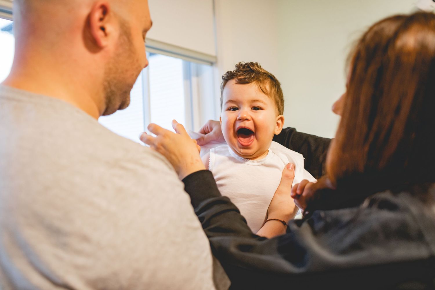 An animated expression captured during a lively moment indoors.