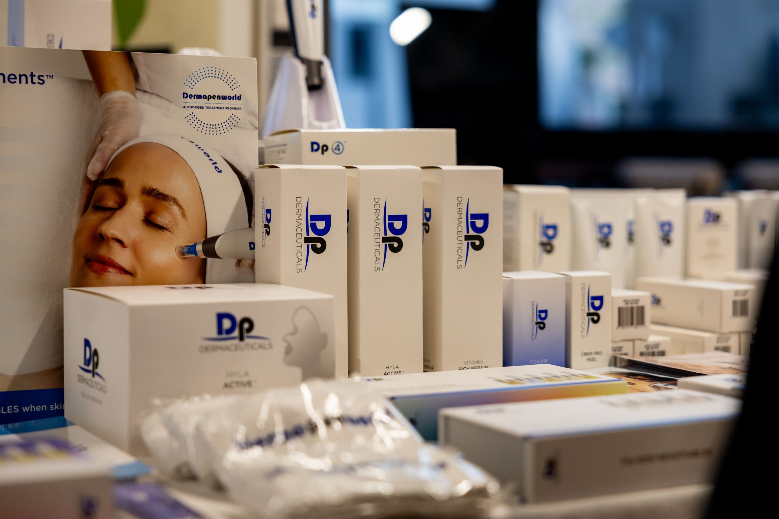 Skincare and beauty products lined up on display with Dr branded packaging.
