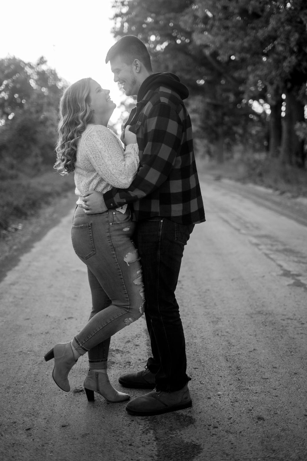A playful black and white moment captured on a country road.