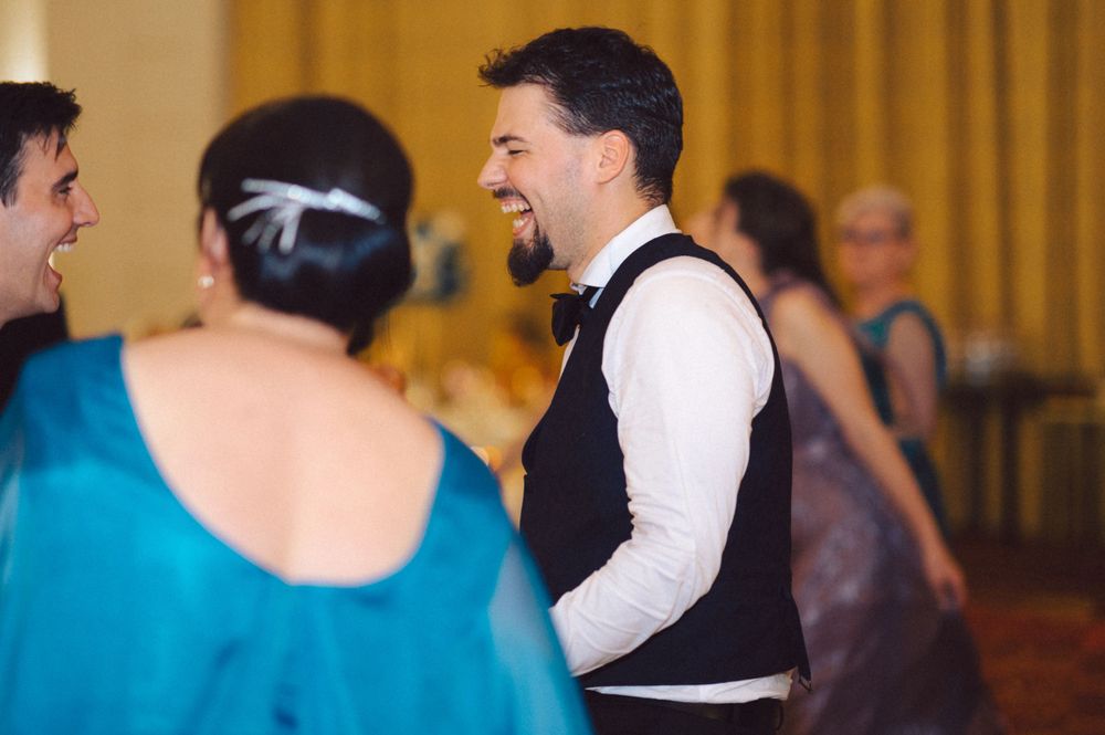 Lively conversation between guests during wedding reception.