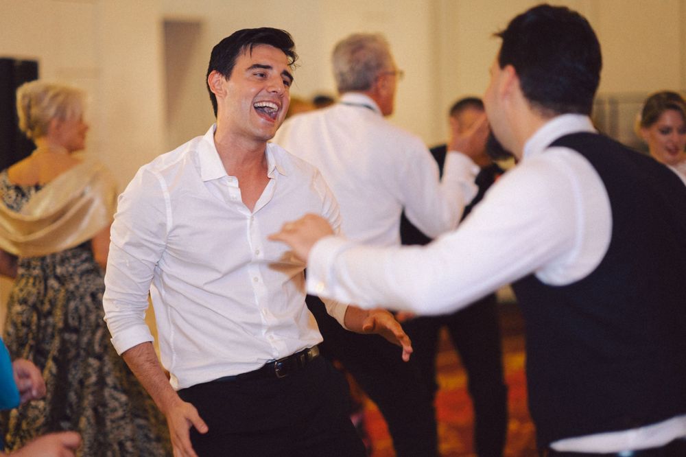 Animated dancing and celebration at wedding reception.