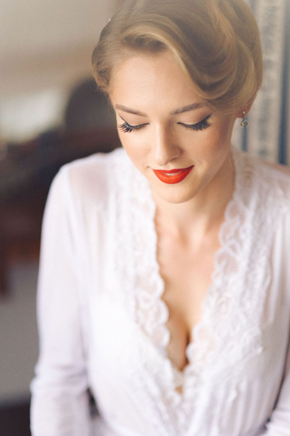 Romantic bridal portrait featuring soft lighting and classic vintage-inspired styling.