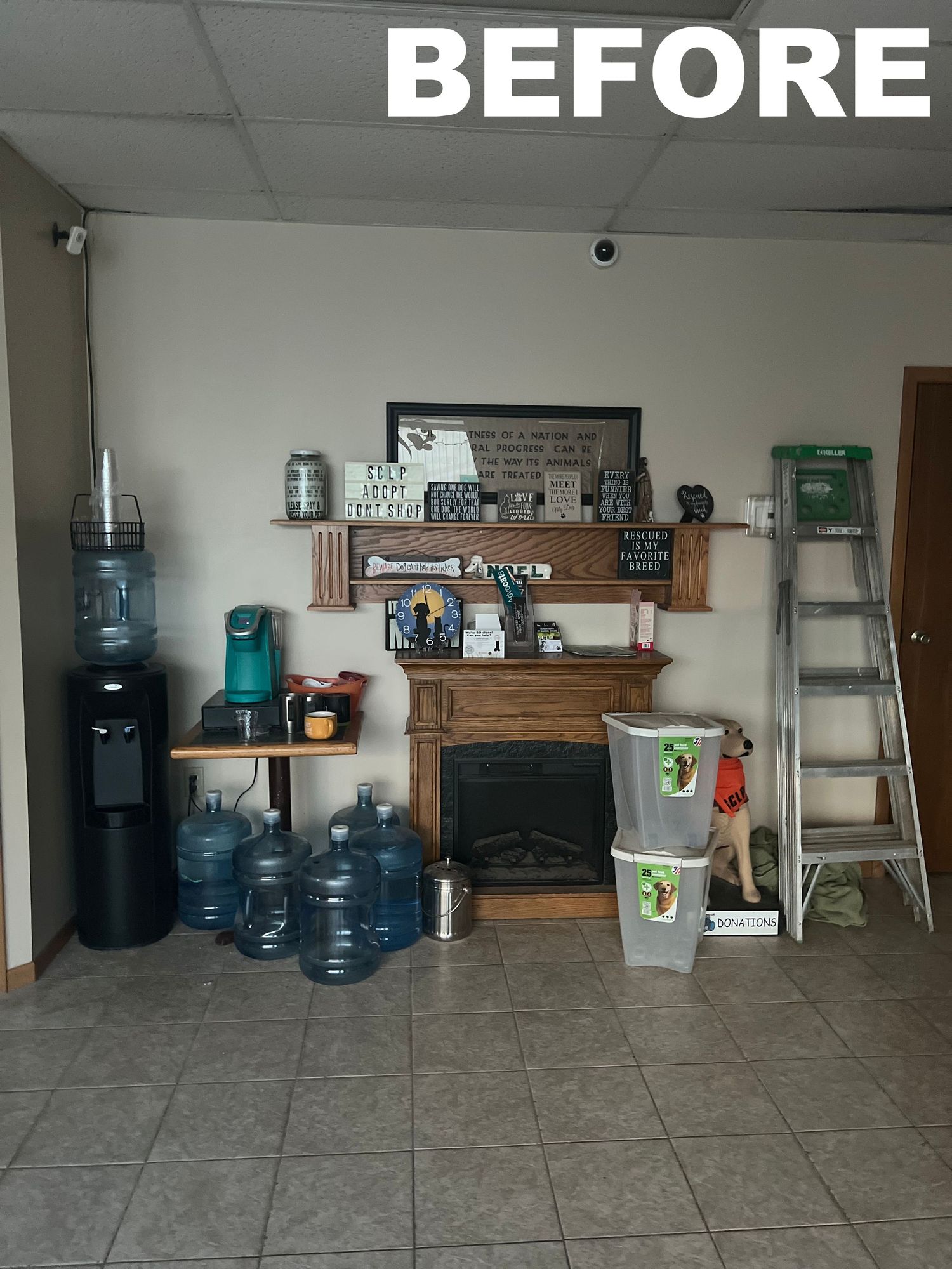 Storage room filled with water coolers and various supplies arranged against white walls.