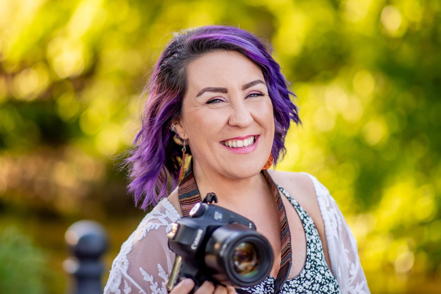 smiles portrait woman purple green sunset vibrant nature photo