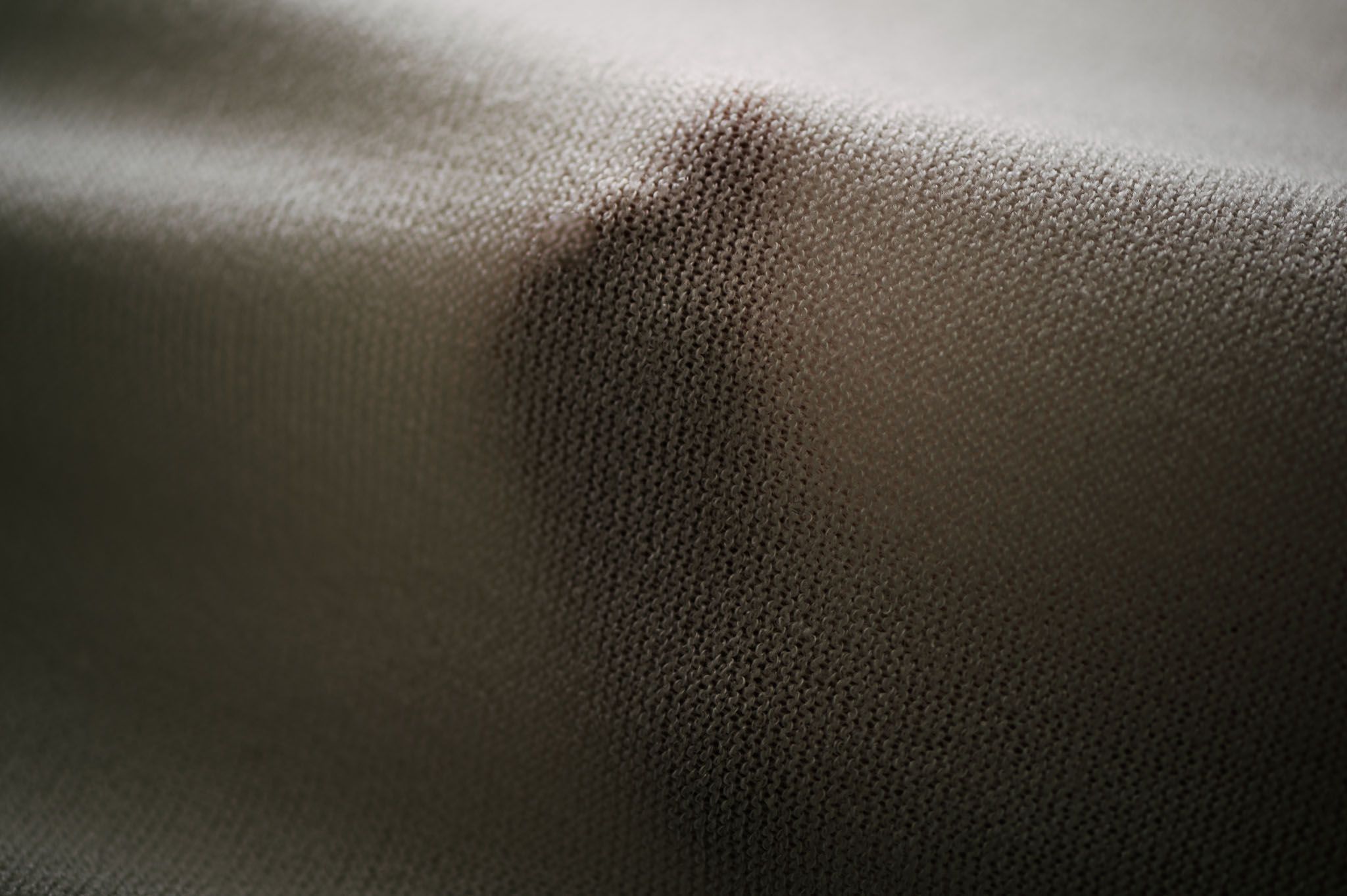 Close up macro texture of soft fabric with shallow depth of field.