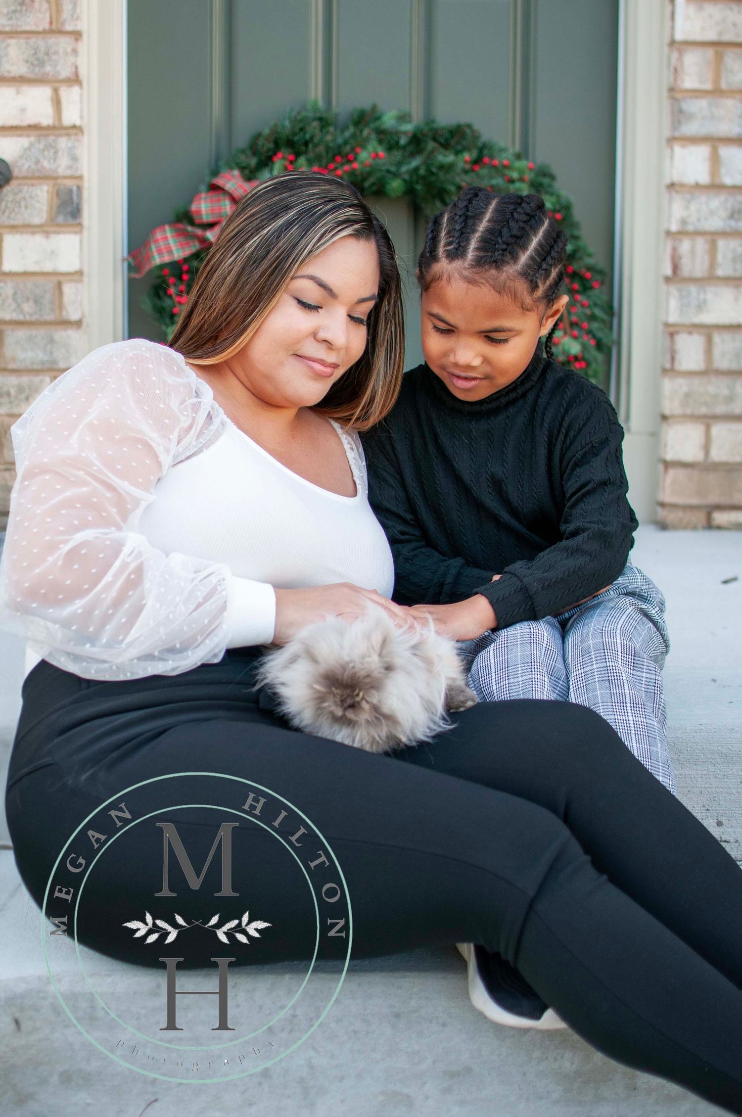 Mom and kid holding pet for photo
