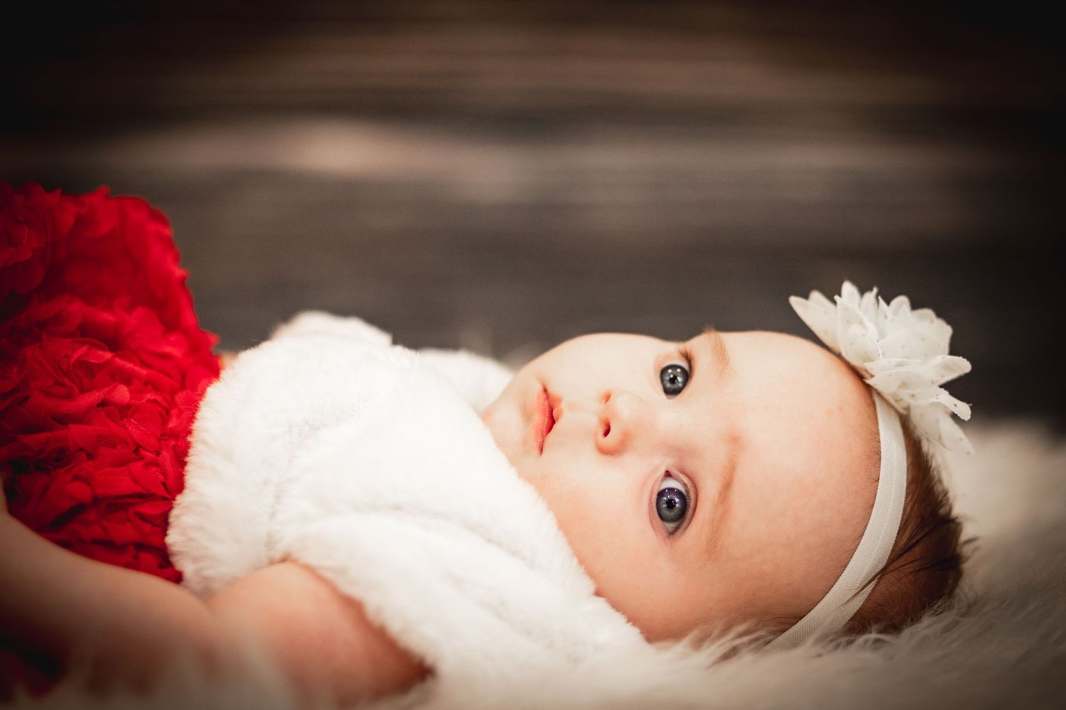 innocent baby dress in holiday outfit indoor holiday scene