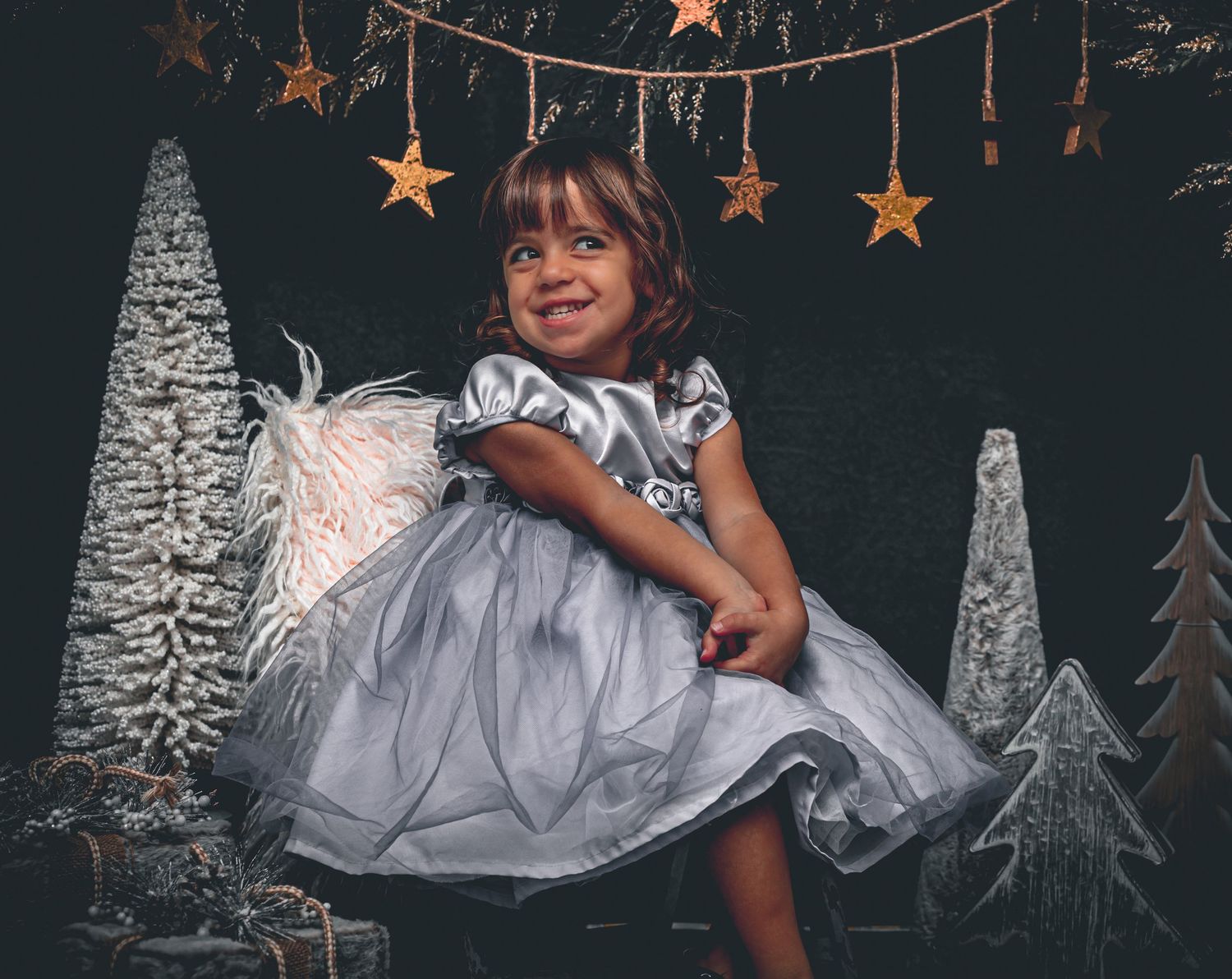 Striking a pose this girl is nothing but joyful and triumphant in her holiday portrait