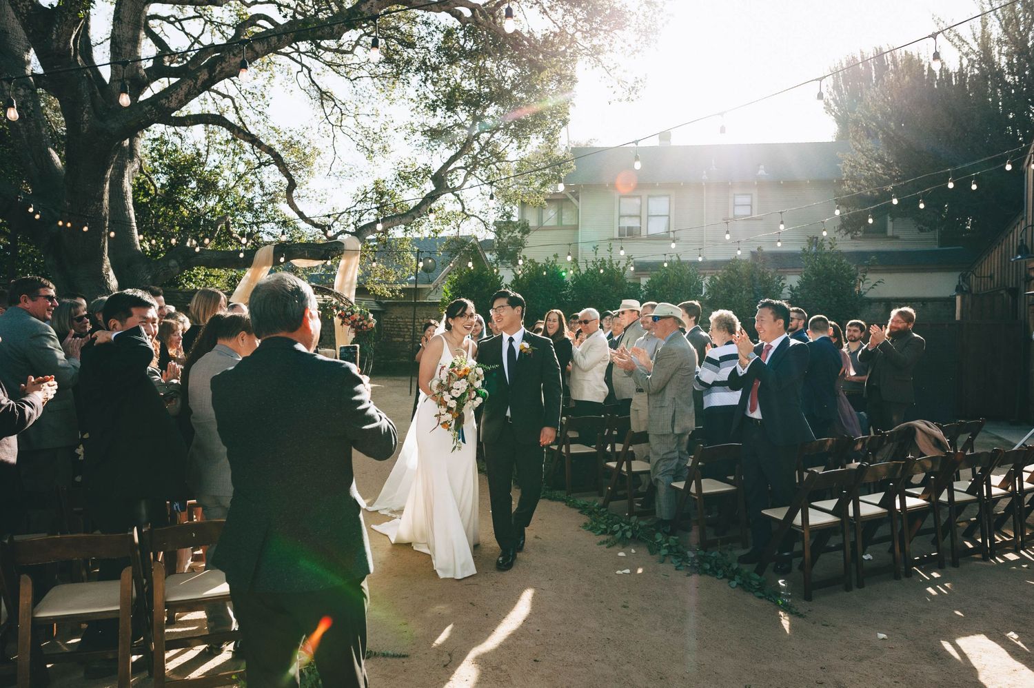 bride and groom exiting the ceremony as husband and wife in Monterey