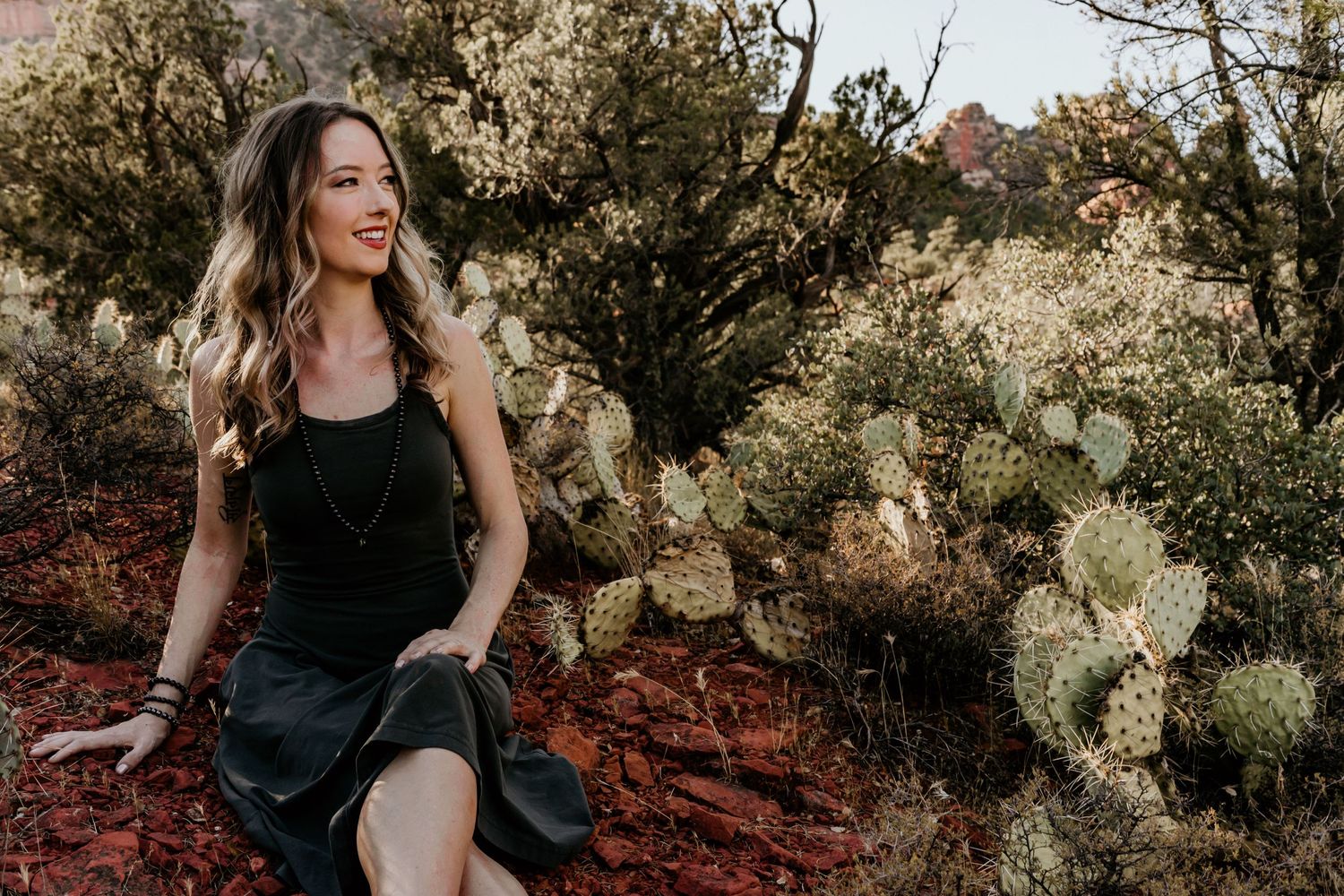 Healer Sitting By Cactus in Sedona Arizona