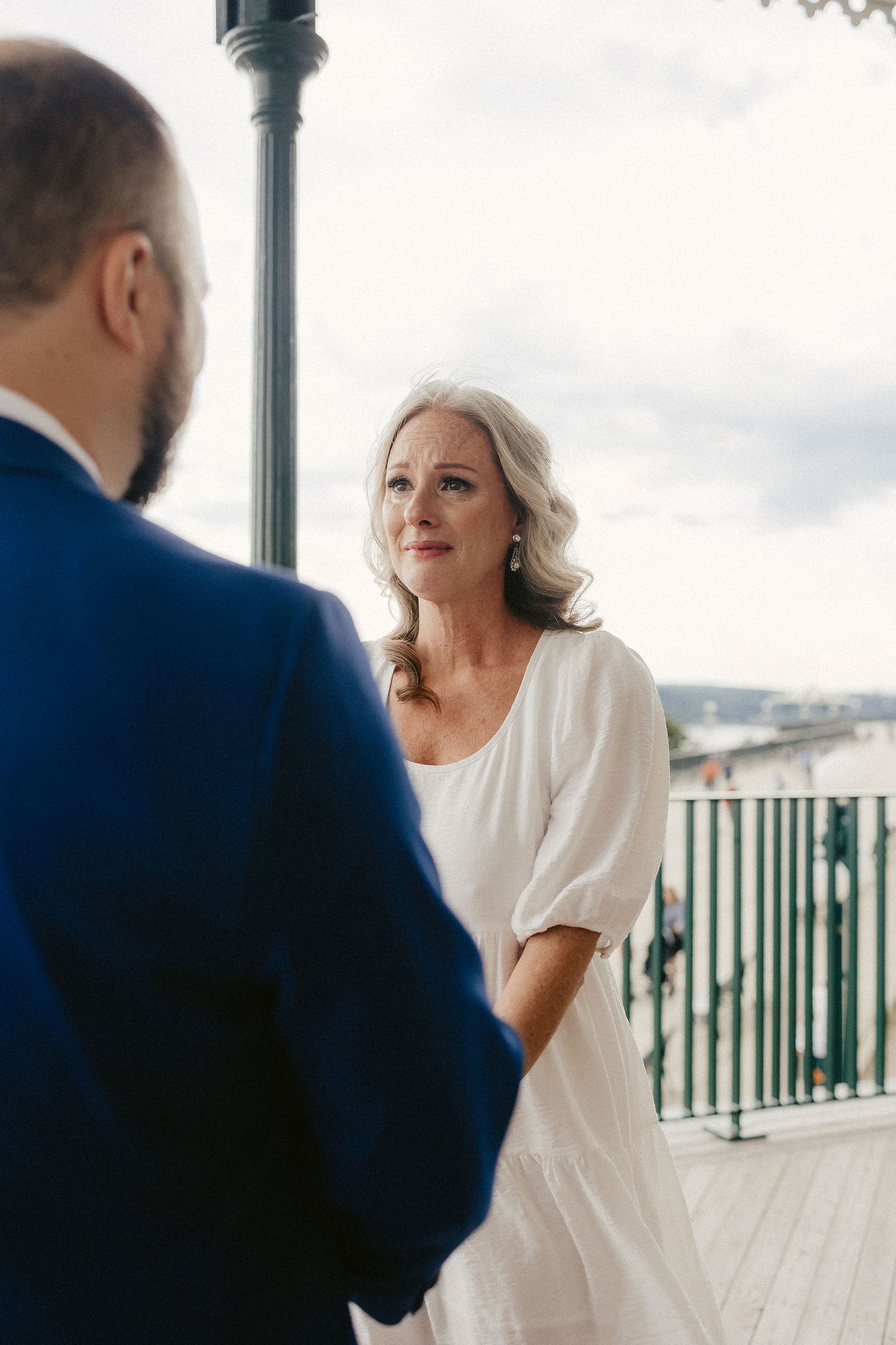 A romantic exchange between a couple during their wedding ceremony.