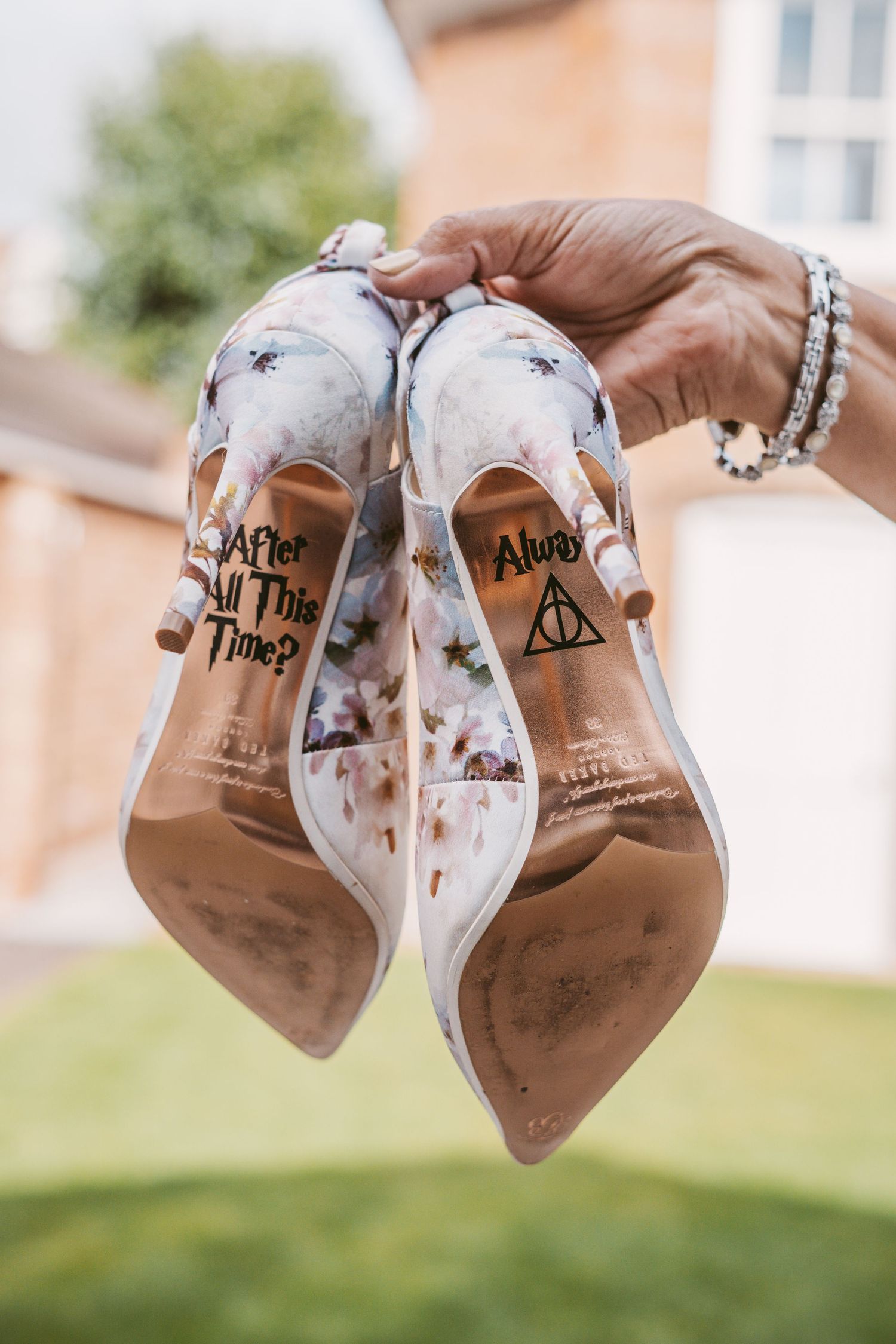 Wedding shoes with Harry Potter themed 'After All This Time' and Deathly Hallows symbols written on the soles.