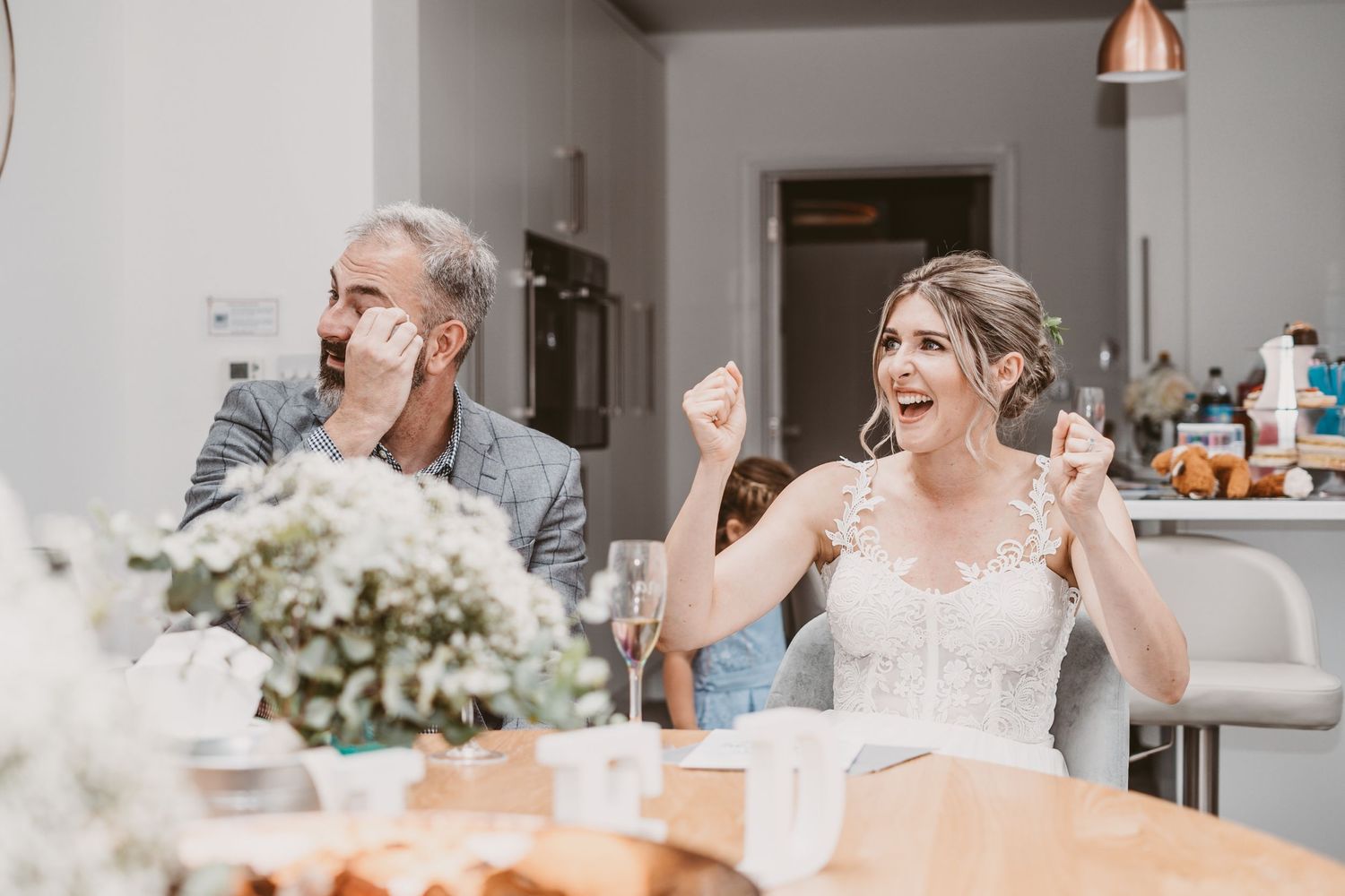 A candid moment of shared laughter during a celebratory meal.