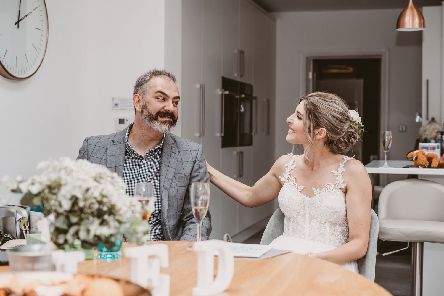 A playful interaction captured during a celebration at a dining table.
