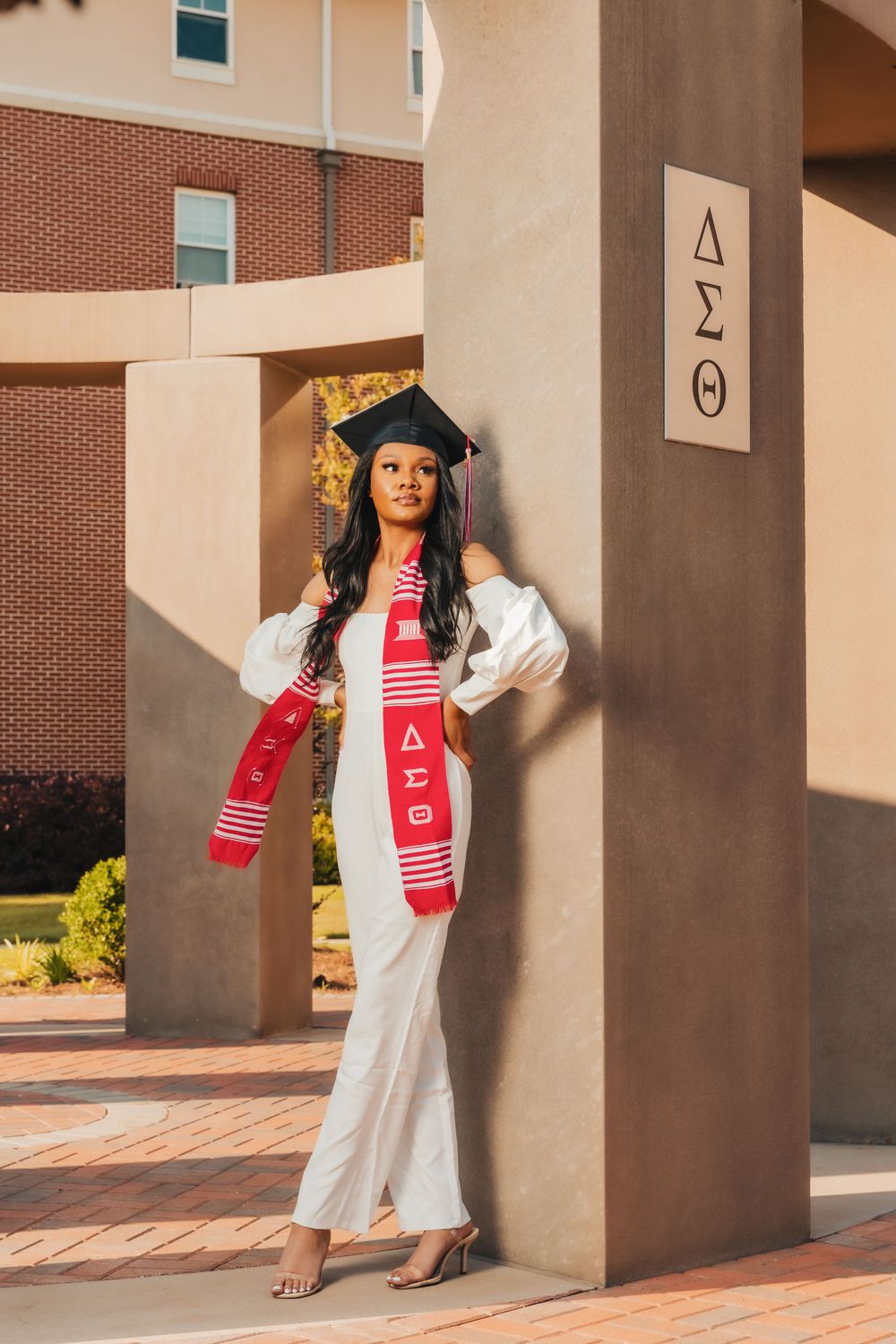 College graduate in cap and gown, sorority, Delta
