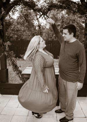Black and white sequence showing a couple's playful interaction on an outdoor bench.