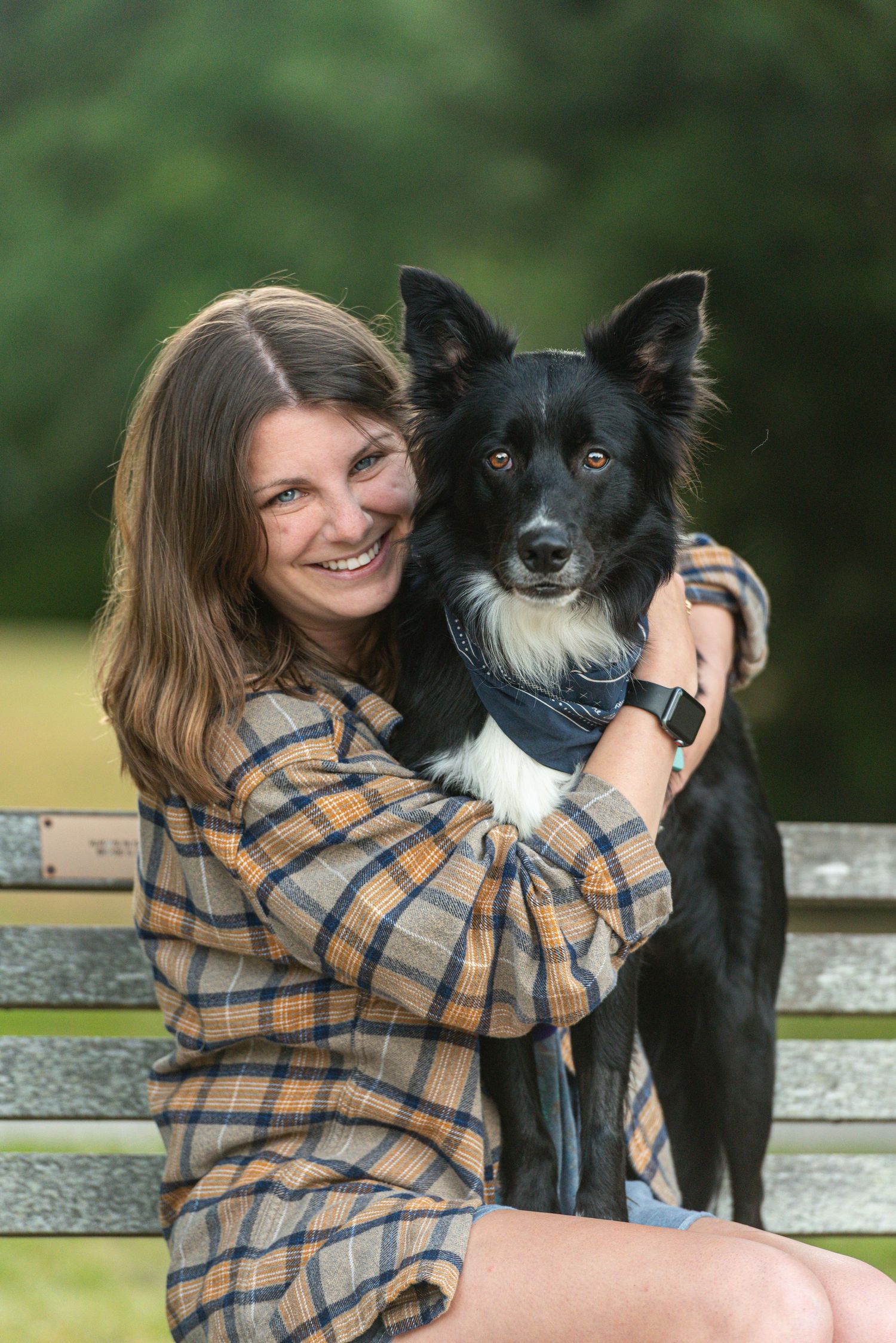 Young lady & Border Collie photographed by SC dog photographer sitting on park bench in Charleston, South Carolina.