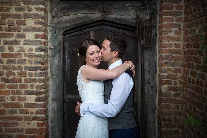 Bride & Groom cuddling at Gorcott Hall