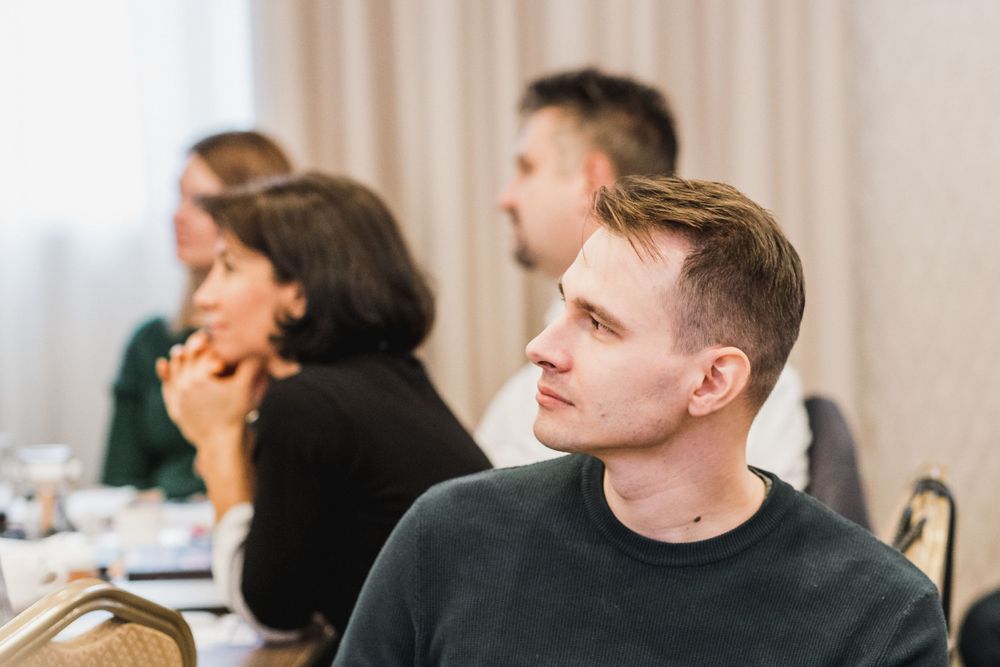 Attentive participants listening during a professional conference or seminar.