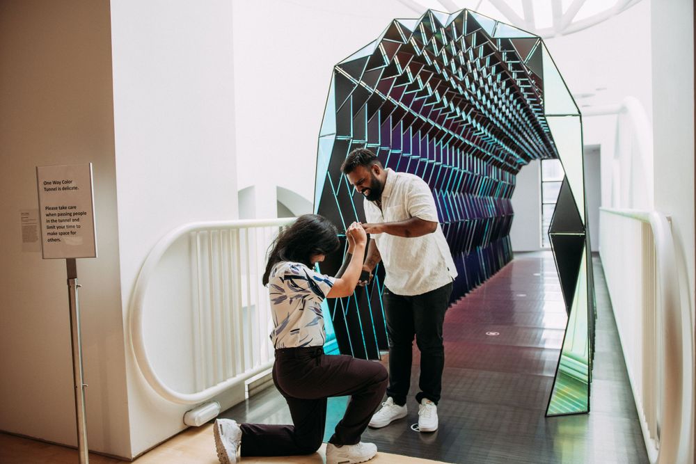 LGBTQ proposal in front of one way color tunnel at SFMoMA.