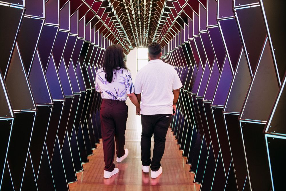 LGBTQ proposal in front of one way color tunnel art exhibit at SFMoMA.