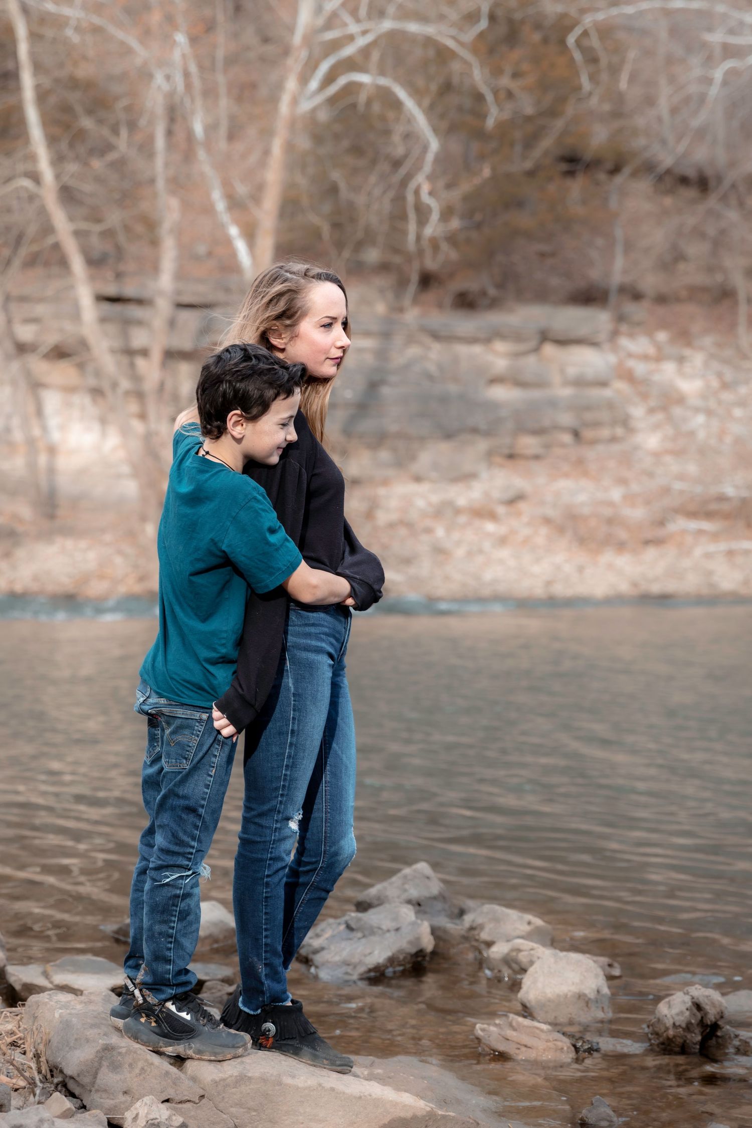Family portrait in the Current River — relaxed, natural light — Laura Simpson