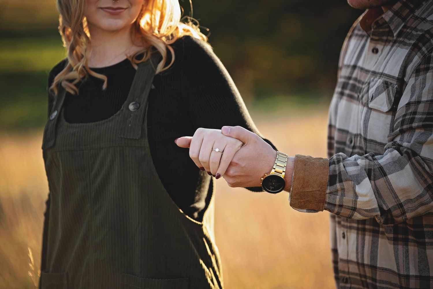 Couple shares tender moment during golden hour outdoor portrait session.