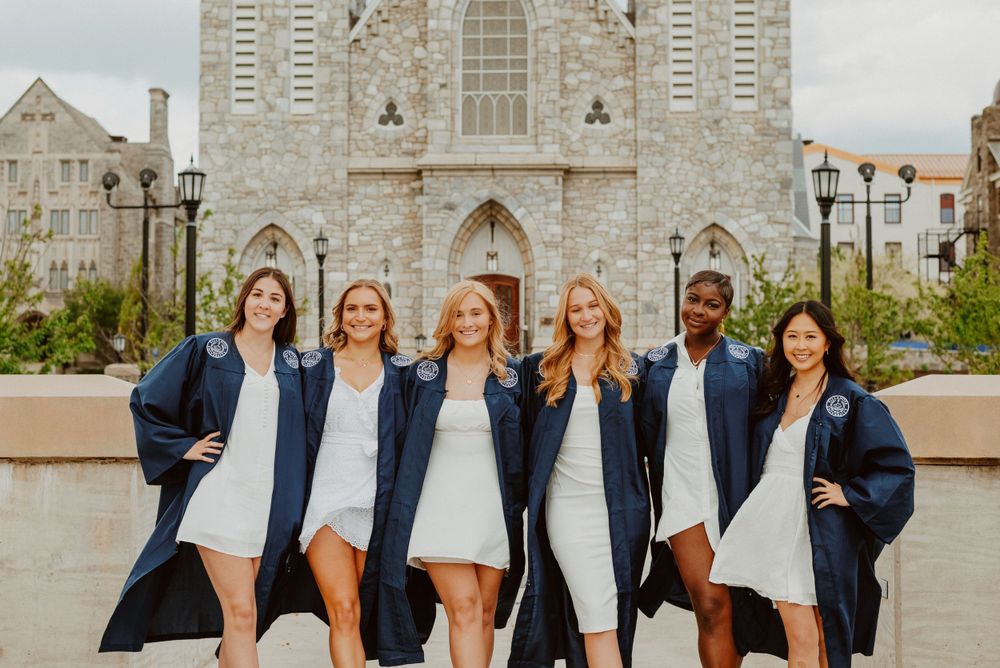 College graduates at Villanova University on church bridge