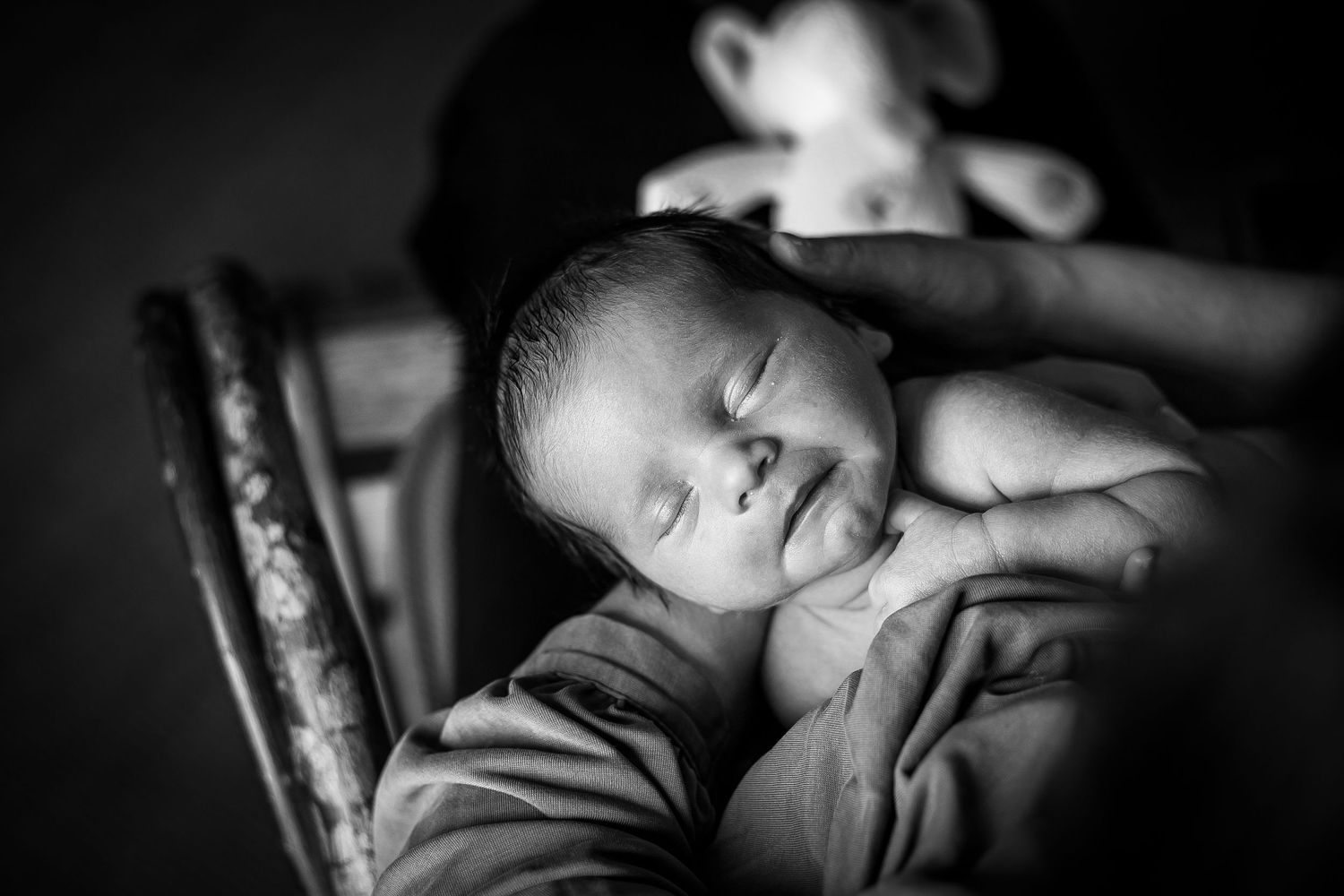 Newborn boy held by his mom in their home in Sioux City, Ia.