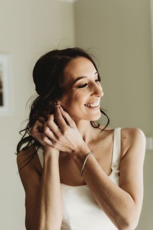 A candid moment of preparation showing joyful expressions and natural lighting.