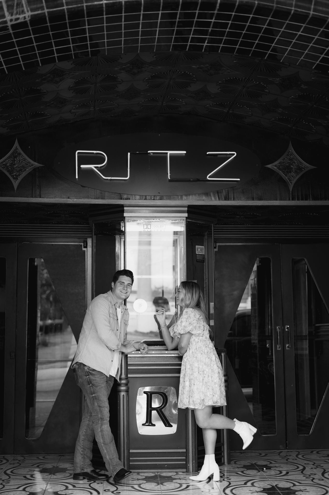 A vintage scene at the Ritz theater with art deco design elements and dramatic lighting.