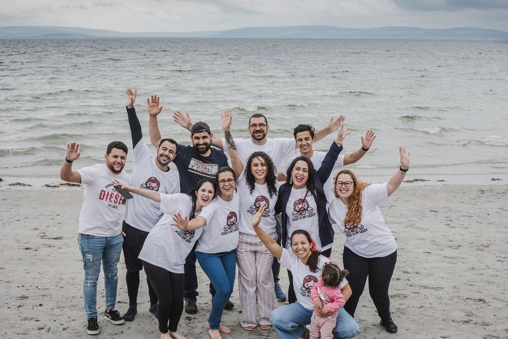 woman having a baptising ceremony in Salhill, Galway, Ireland, saying prayers, singing and celebrating this special moment with her friends