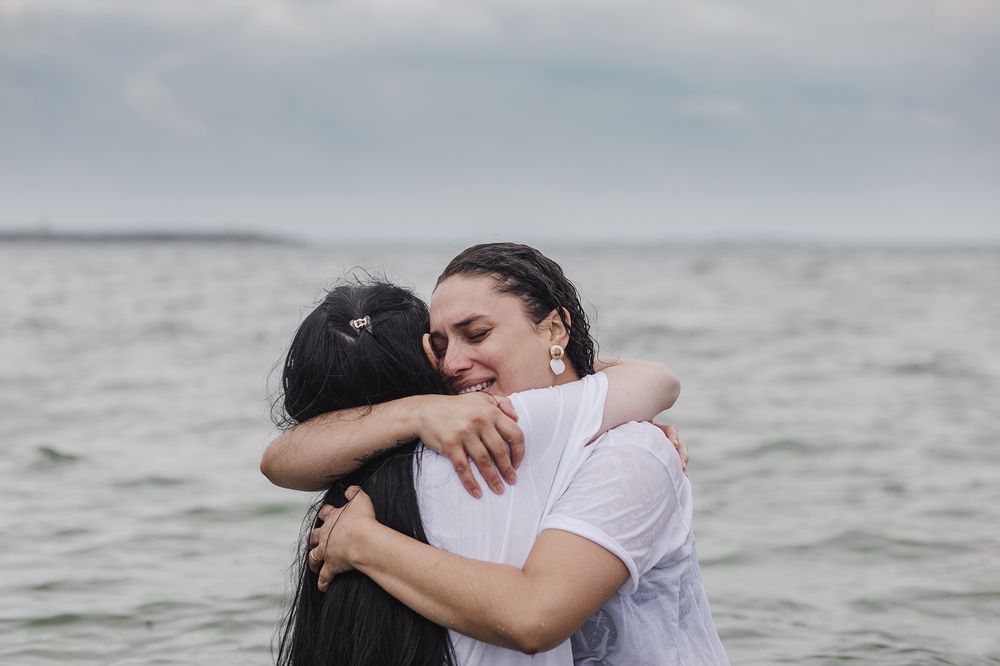 two woman hugging