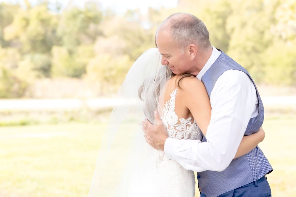 Candid wedding moments captured during golden hour in an outdoor setting.