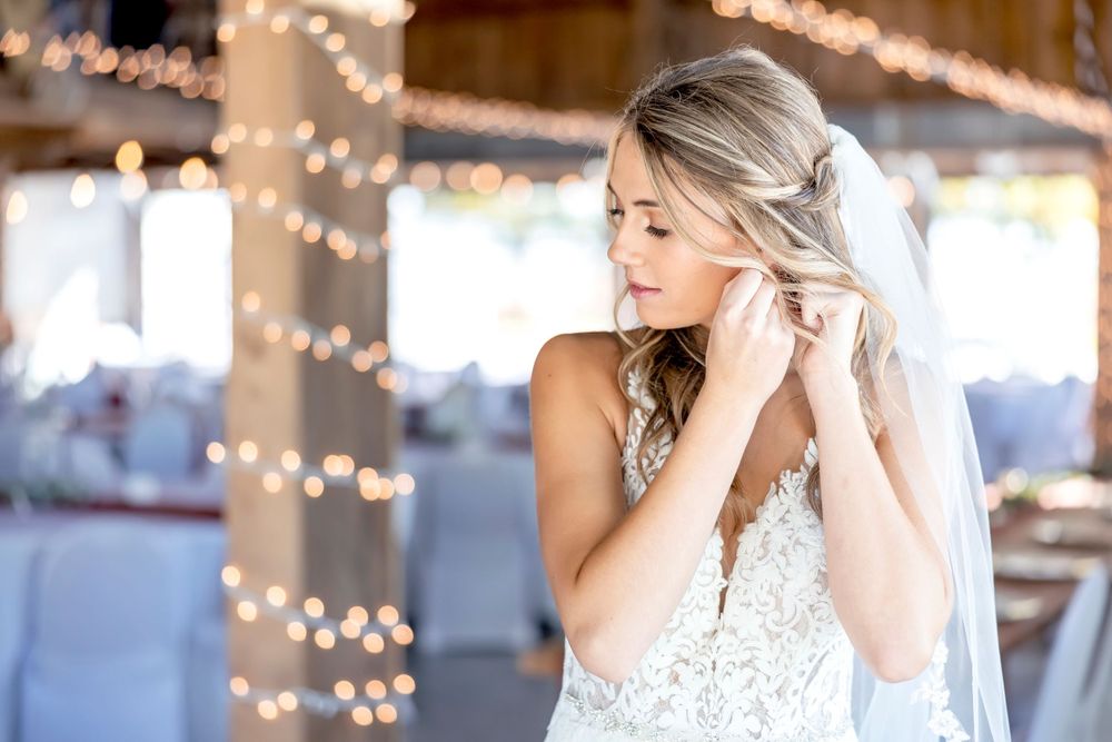 Wedding preparation scene with string lights creating a warm, romantic ambiance.