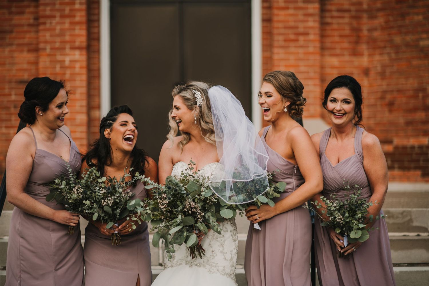 bridesmaids laughing together