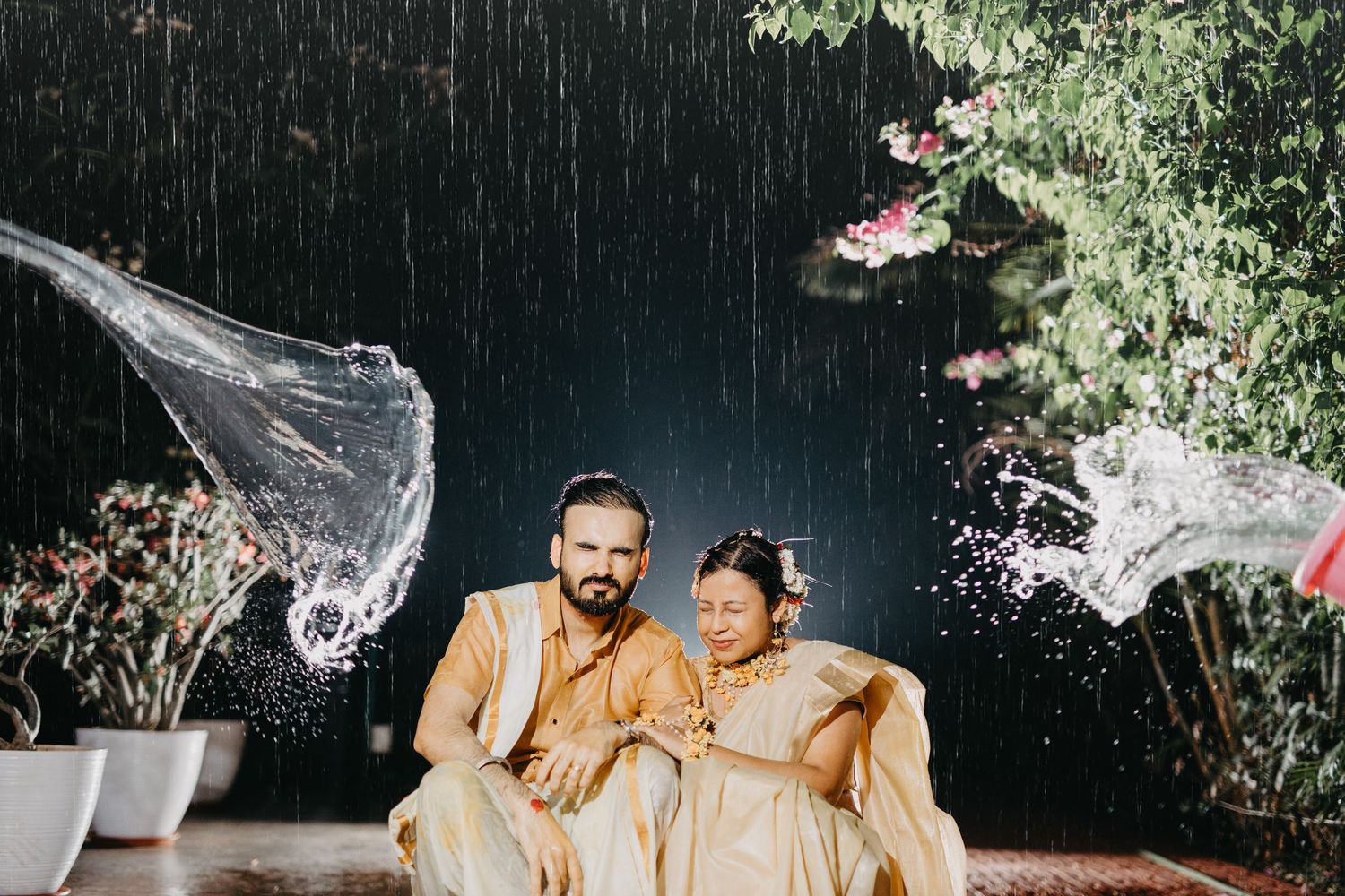 Dramatic water splash effect captured during outdoor evening celebration.